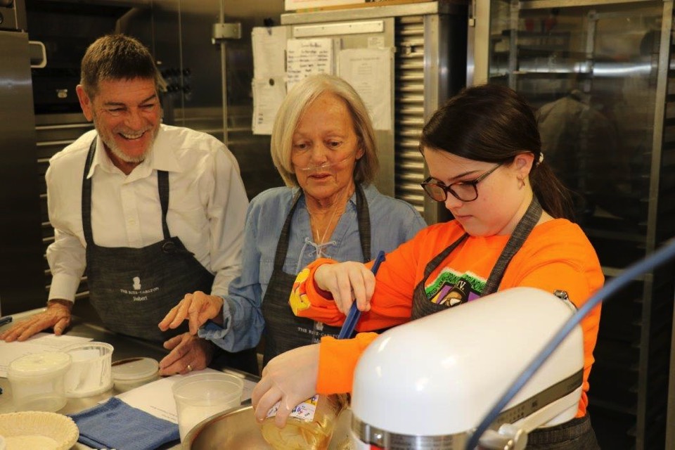 JAJF family cooking in kitchen enjoying The Power of WOW experience 