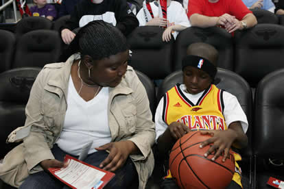 JAJF mom and son at Atlanta Hawks basketball game 