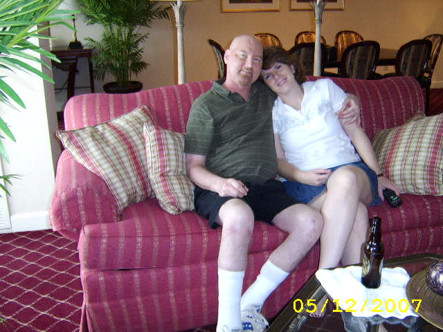 JAJF couple on couch in hotel room treating the families not the cancer 