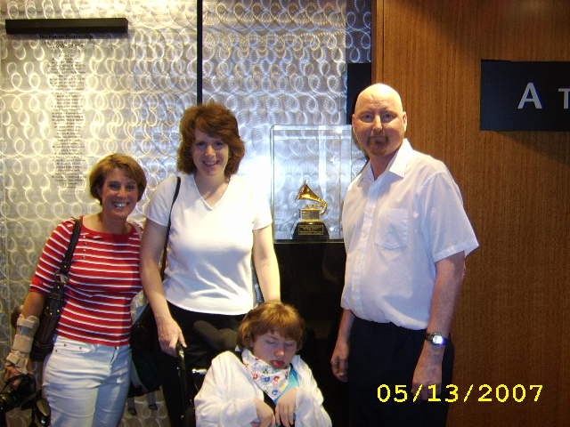 JAJF family in front of Grammy statue treating the families not the cancer 