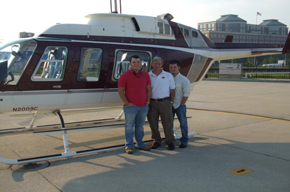JAJF family beside a helicopter enjoying a late stage cancer timeout 