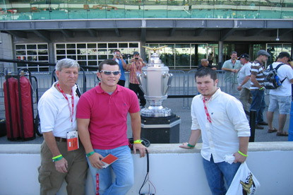 JAJF father and sons enjoying a WOW experience beside NASCAR cup award 