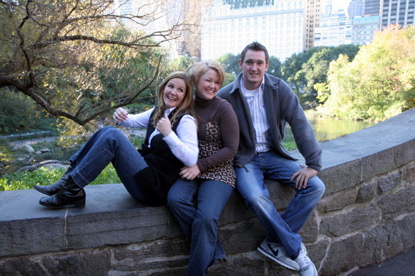 family sitting on bridge in Central Park enjoying a Jack and Jill Foundation WOW experience 