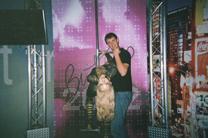 young man with Britney Spears wax figure at Madame Tussaud's on a JAJF WOW experience 