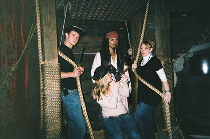 young woman with Pirates of the Caribbean wax figures on a JAJF WOW experience 