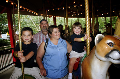 family on carousel enjoying a Jack and Jill Foundation WOW experience 