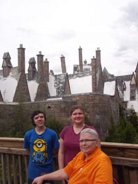 family posing in Harry Potter World at Universal Studios enjoying The Power of WOW experience 