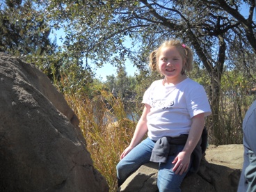 JAJF girl smiling on rock the best part of memories is making them 