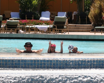 JAJF family playing in pool receiving a cancer break treatment 