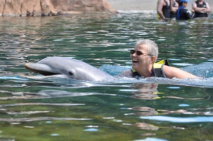 Jack and Jill Foundation man swimming with dolphins 
