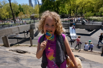 Jack and Jill Foundation with young girl licking lollipop 