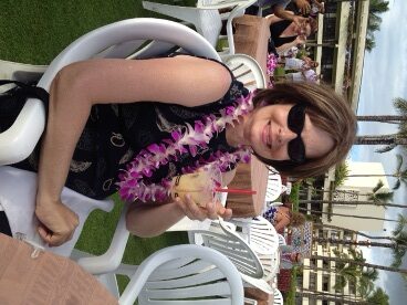 Jack and Jill Foundation woman with a lei enjoying a cocktail 