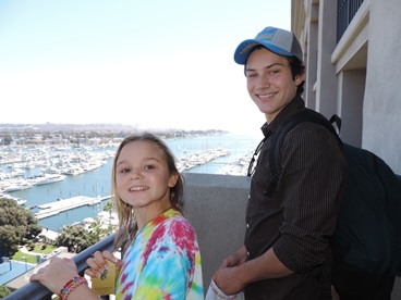 Jack and Jill Foundation siblings on hotel balcony enjoying a timeout from late stage cancer 