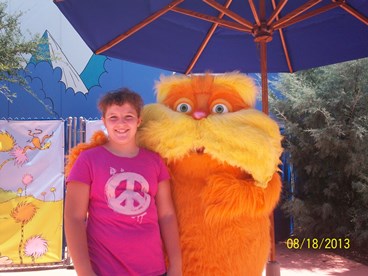 young girl with Lorax taking a timeout from late stage cancer 