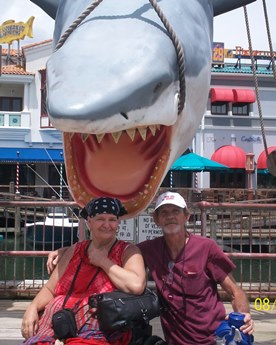 family with shark statue at Universal Studios taking a timeout from late stage cancer 