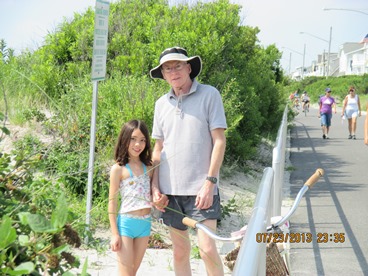 dad and daughter on the beach taking a timeout from late stage cancer 