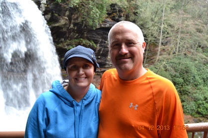 JAJF couple on hike by a waterfall taking a timeout from late stage cancer 