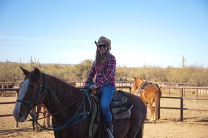 JAJF girl with cowboy hat horseback riding 