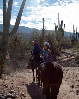 JAJF family horseback riding in dessert with cactus 