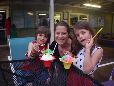 JAJF family sitting on lanai eating flavored ice 