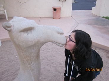 JAJF girl kissing camel statue the best part of memories is making them 