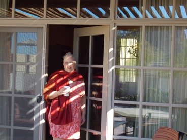 JAJF woman on lanai with coffee 