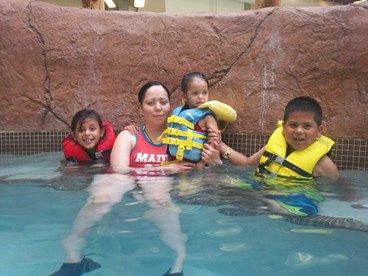 JAJF family in swimming pool treating the families not the cancer 