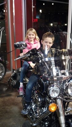 brother and sister on motorcycles enjoying JAJF break 