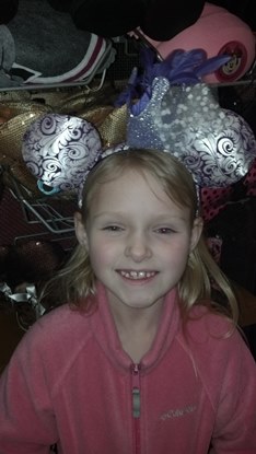 young girl with Minnie mouse ears enjoying a JAJF WOW Experience 