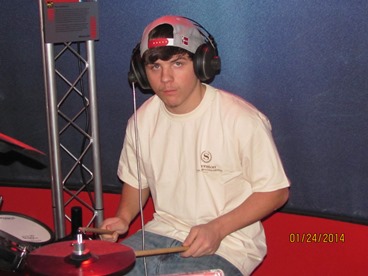 JAJF boy playing drums treating the families not the cancer 
