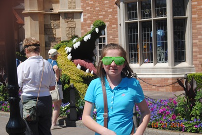JAJF girl with funky sunglasses posing with alligator plant 