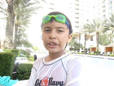 young boy with swimming goggles making JAJF memories 