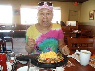 JAJF woman eating breakfast during her late stage cancer vacation 