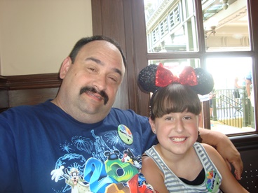 JAJF dad and daughter with Minnie Mouse ears making memories 