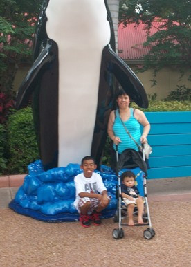 JAJF family posing with orca statute 