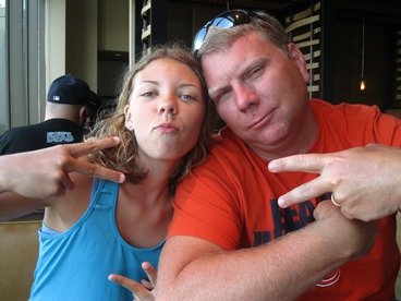 dad and daughter giving peace sign prescribed a break from late stage cancer 
