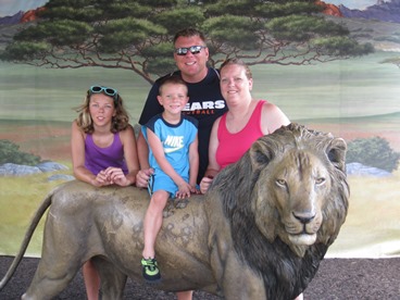 JAJF family posing with lion statute taking a late stage cancer timeout 