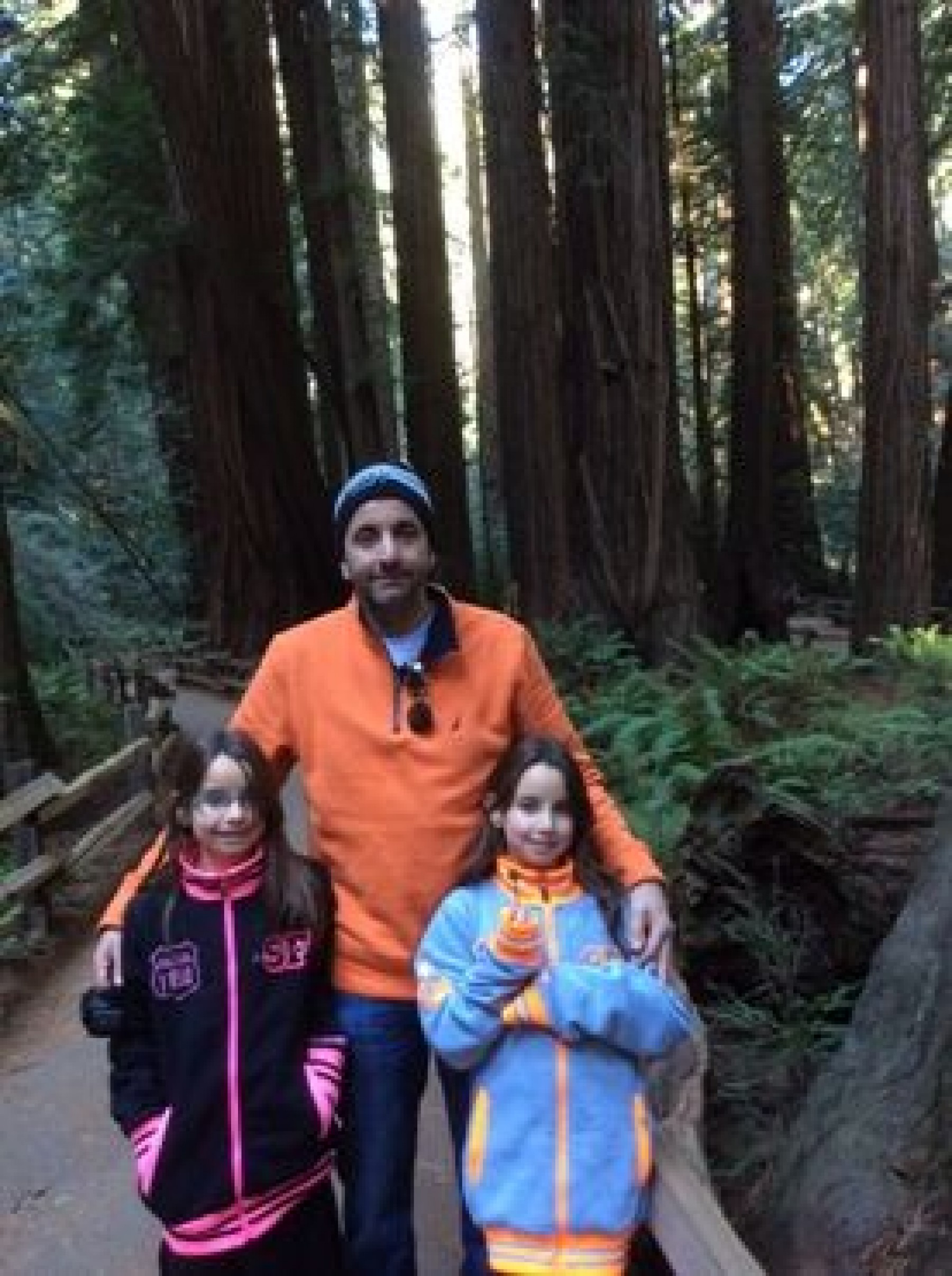 man with daughters on forest hike enjoying a JAJF WOW experience 