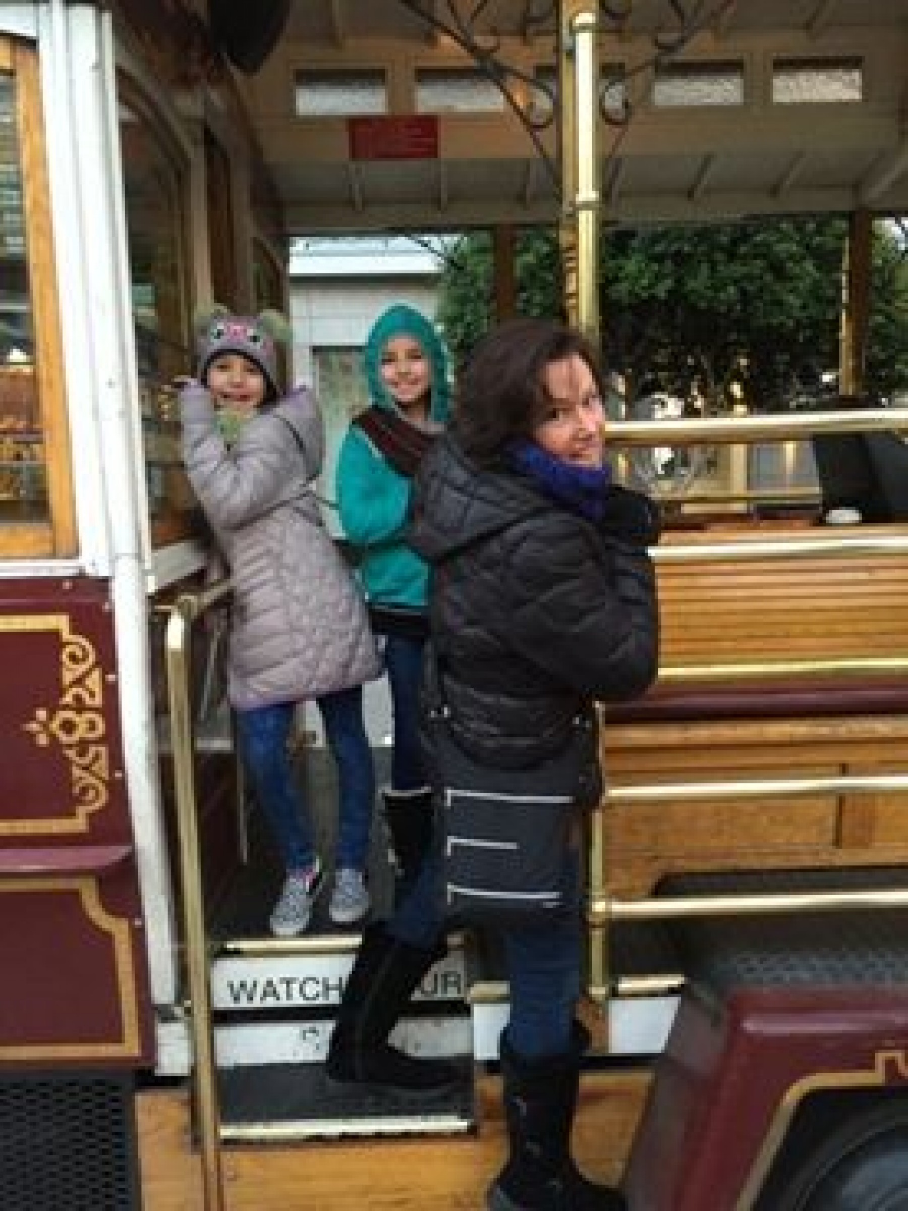 mom and two daughters on trolley during JAJF WOW experience 