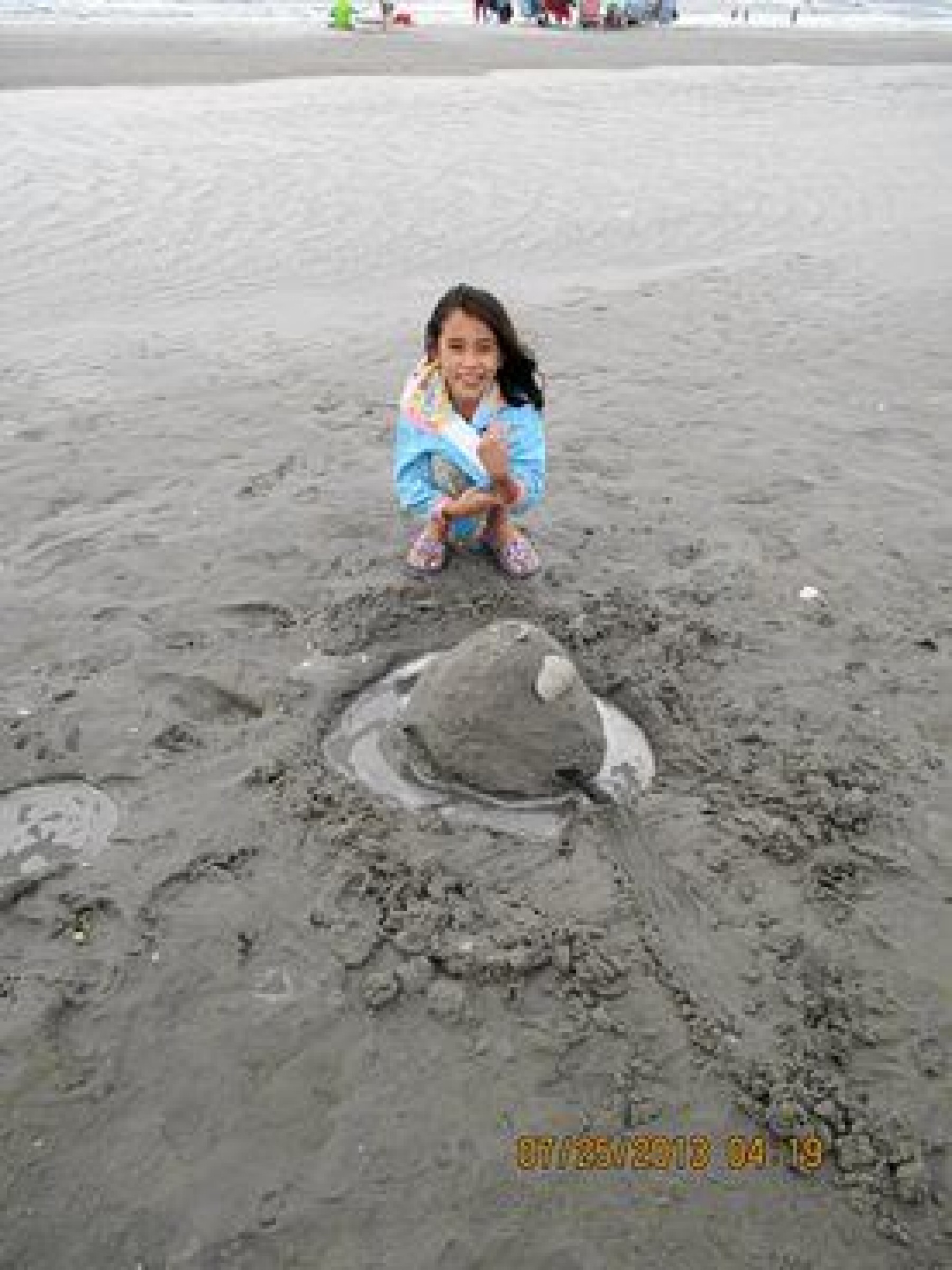 young girl making a sand sculpture during a JAJF WOW experience 