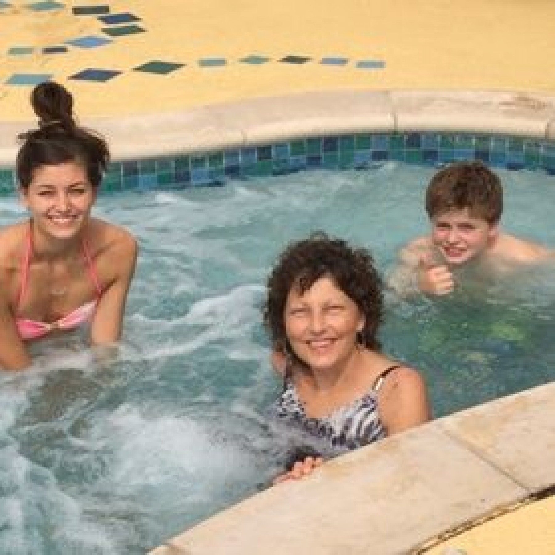 mom and children in hot tub during a JAJF WOW experience 