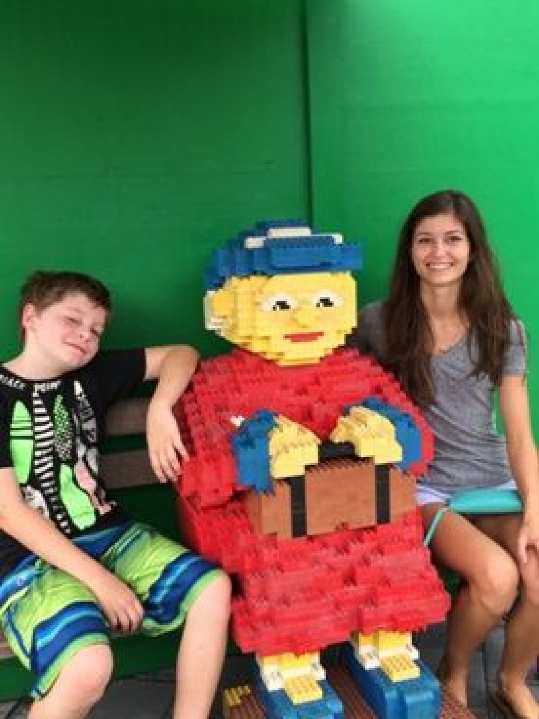 siblings with Lego statue during a JAJF WOW experience 