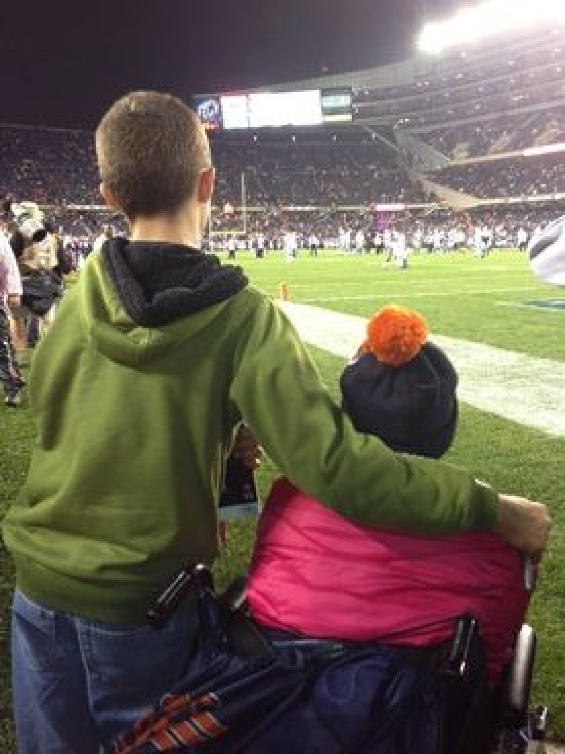 siblings at football game during a JAJF WOW experience 