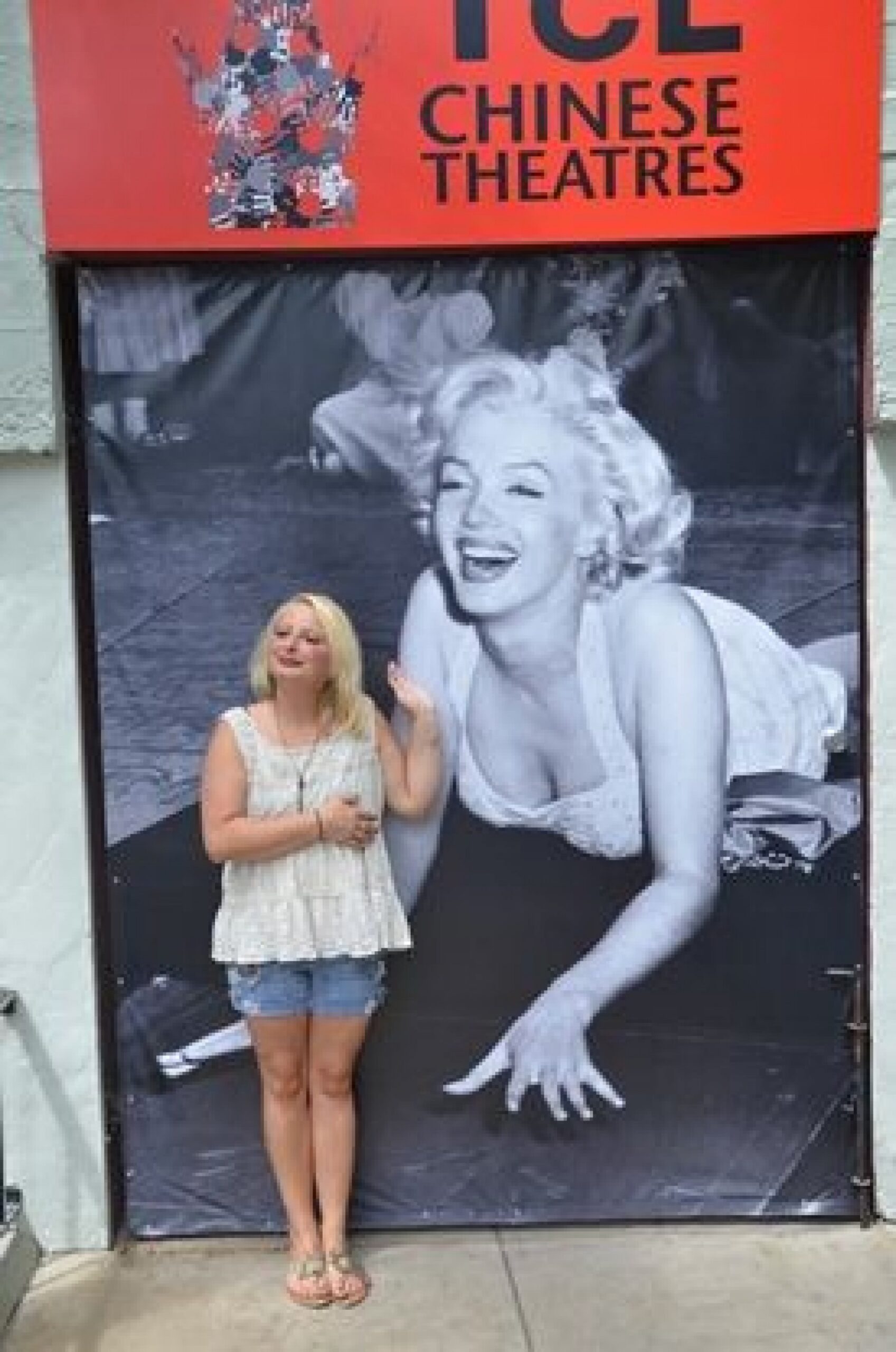 woman posing with Marilyn Monroe picture during a JAJF WOW experience 