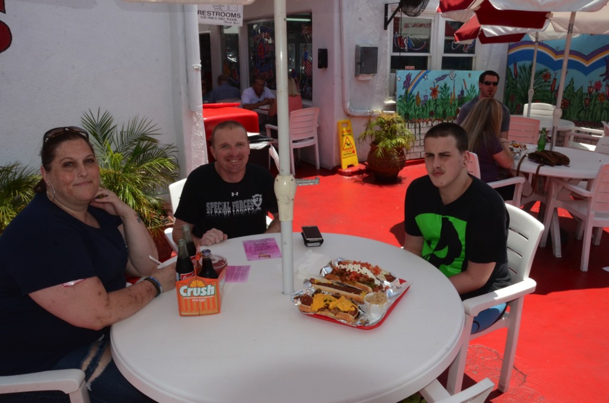 family enjoying Pinks hot dogs during a JAJF WOW experience 