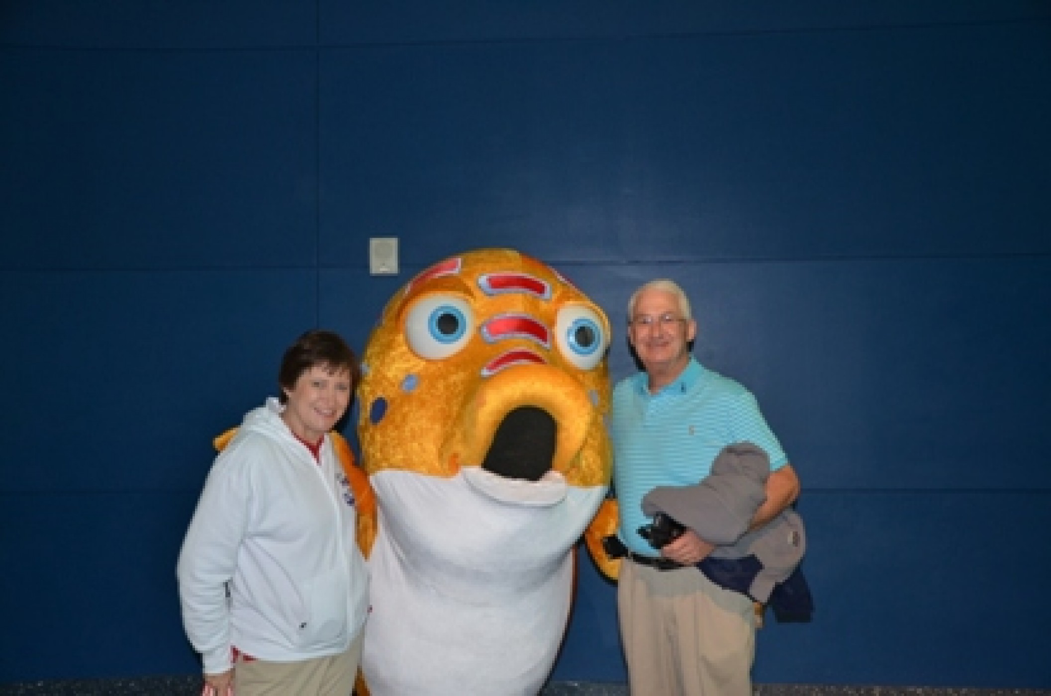 couple with costumed fish during a JAJF WOW experience 