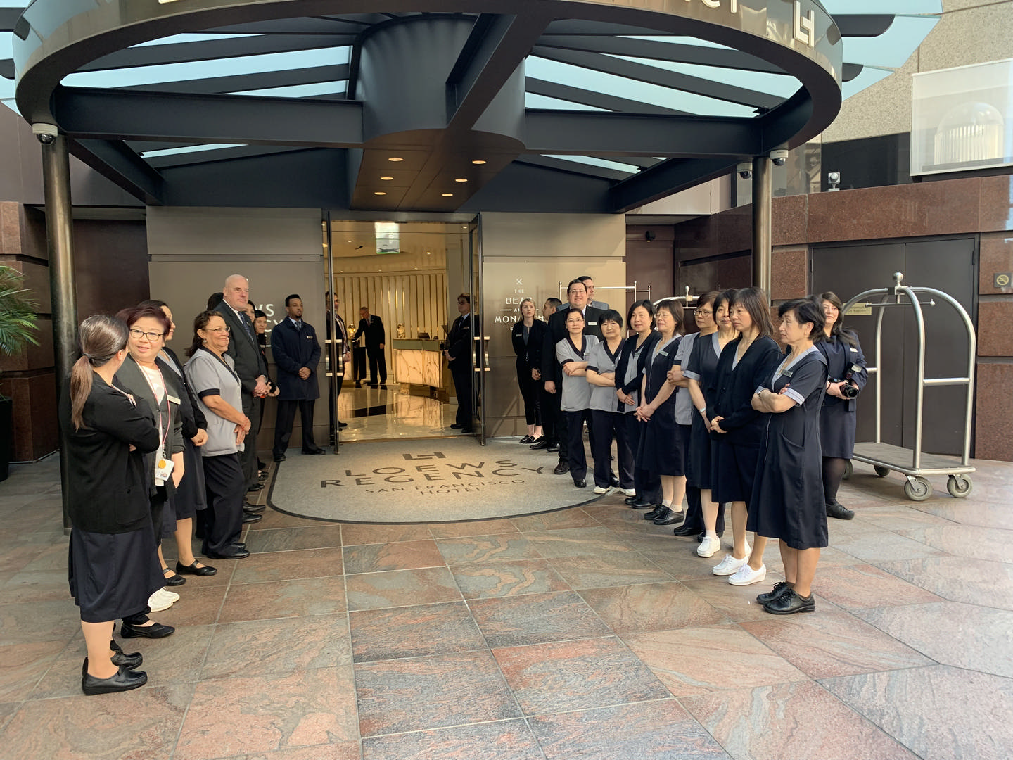 hotel staff lined up outside lobby at Loews Hotel in San Francisco 