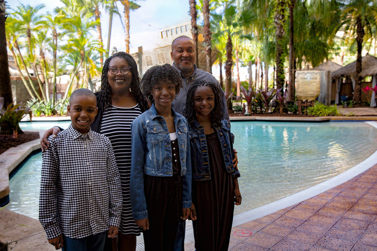 family beside pool enjoying a JAJF late stage cancer timeout 
