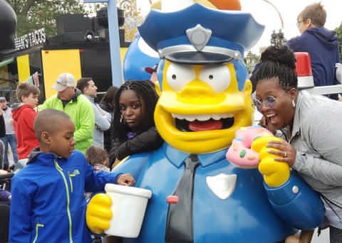 family with Chief Wiggum Simpon cartoon statute enjoying a JAJF late stage cancer timeout 