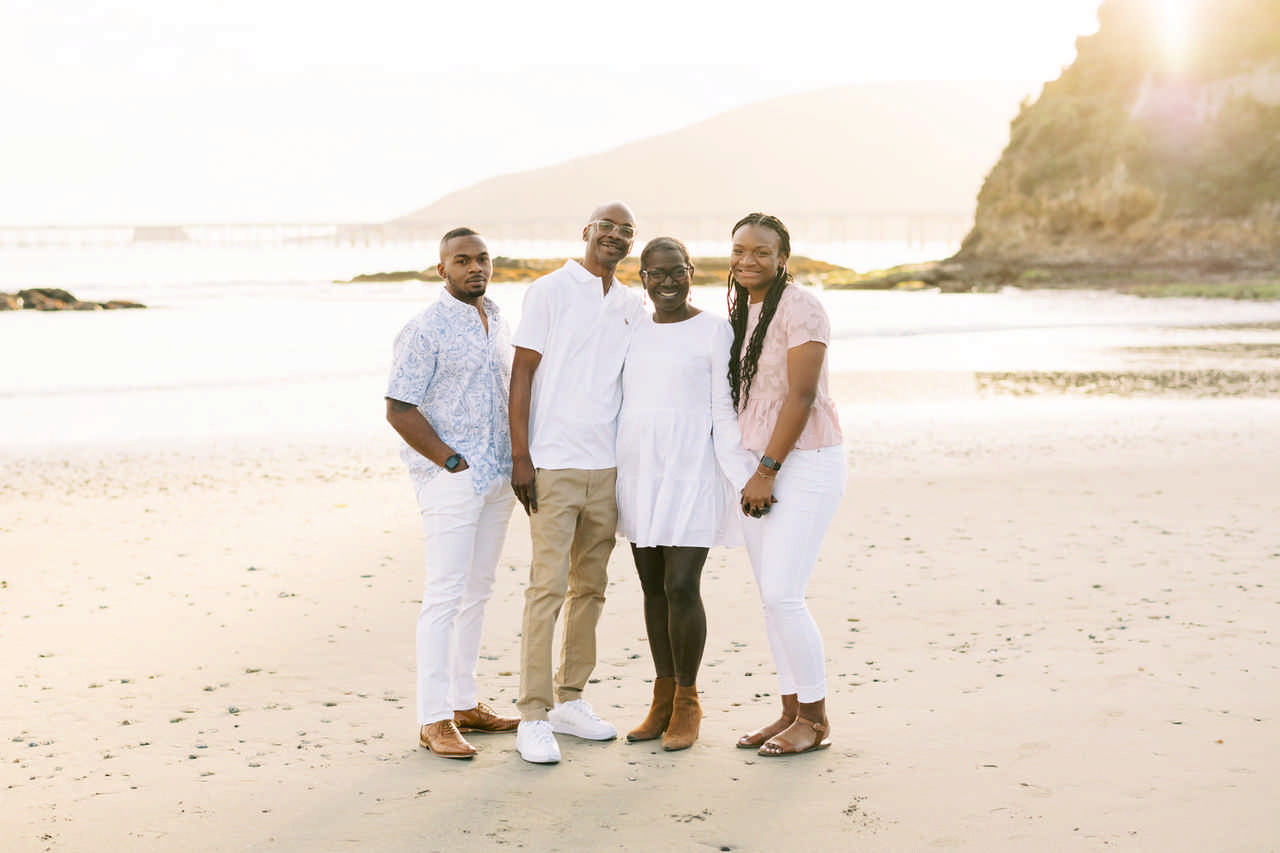 family posing on the beach enjoying a late stage cancer timeout 